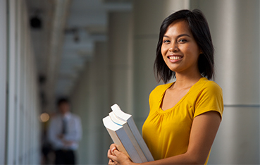 girl holding papers