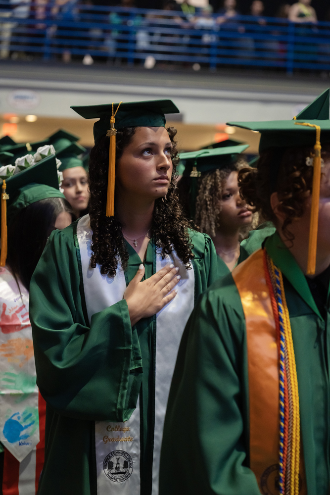 Candid shot of graduates talking and laughing before the ceremony begins