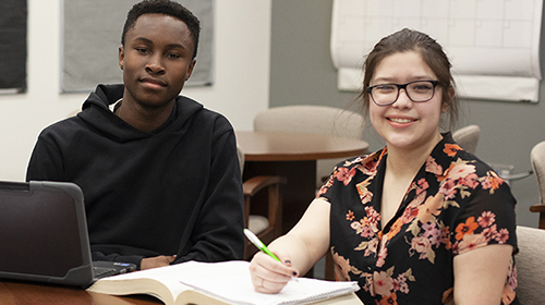Male and Female sitting in classroom